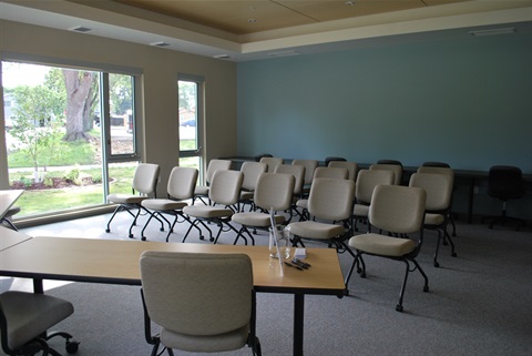 Cottonwood Room showing set up with just chairs as lecture style facing front of room 