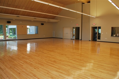 view of empty Maplewood Room showcasing hardwood floors 