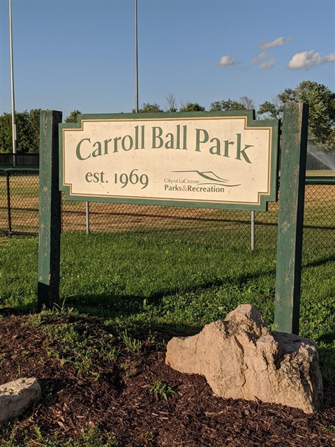 A sign for Carroll Ball Park, established in 1969, with the City of La Crosse Parks & Recreation logo.