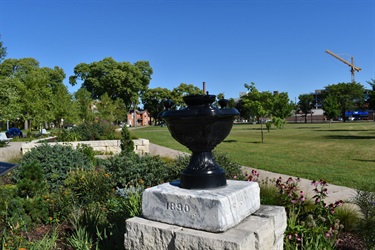 A black urn-shaped monument with 