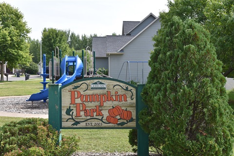 A sign for Pumpkin Park, featuring pumpkins and the words 