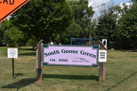 Sign for South Goose Green park, established in 2000, with a 