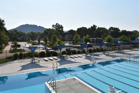 view of Veterans Memorial pool from overhead seeing all of the lap swim lanes and the pool deck with shade structures